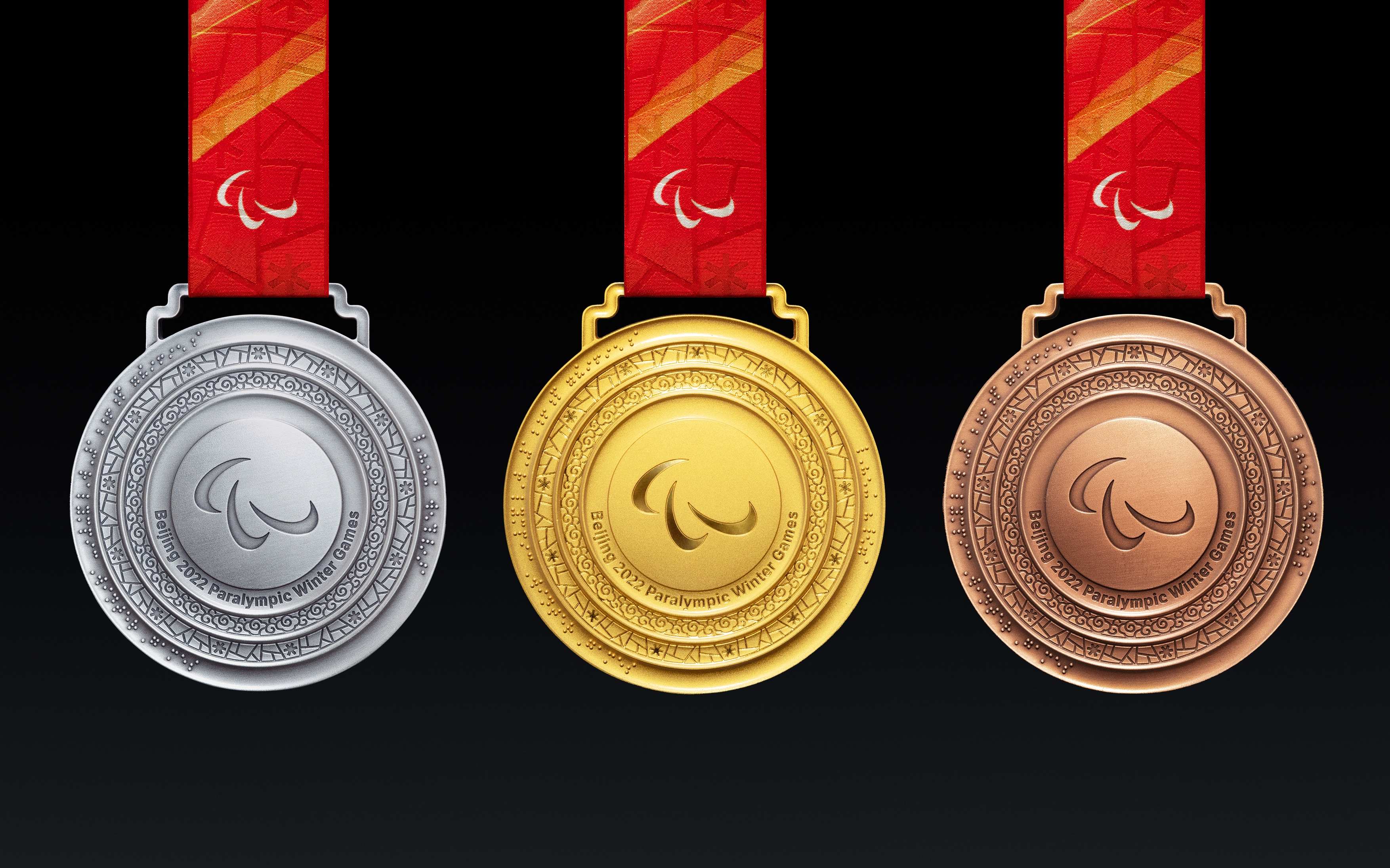 北京残奥会会徽中的三种颜色分别代表什么?